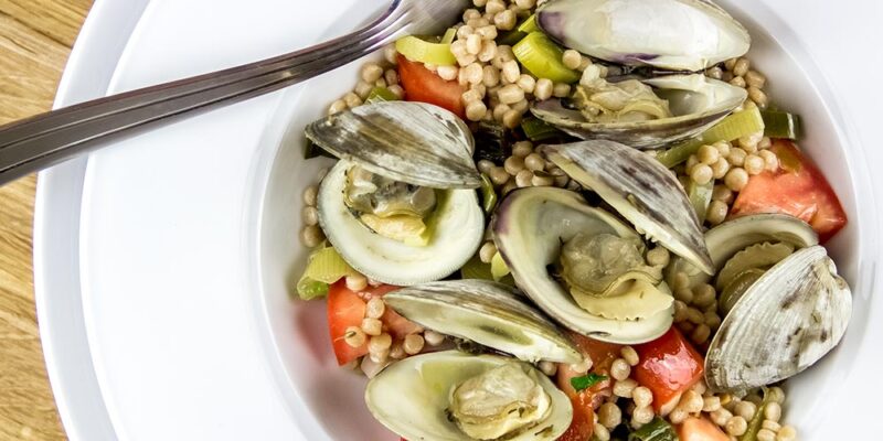 Steamed Littleneck Clams with Pearl Couscous, Leeks & Tomatoes Recipe