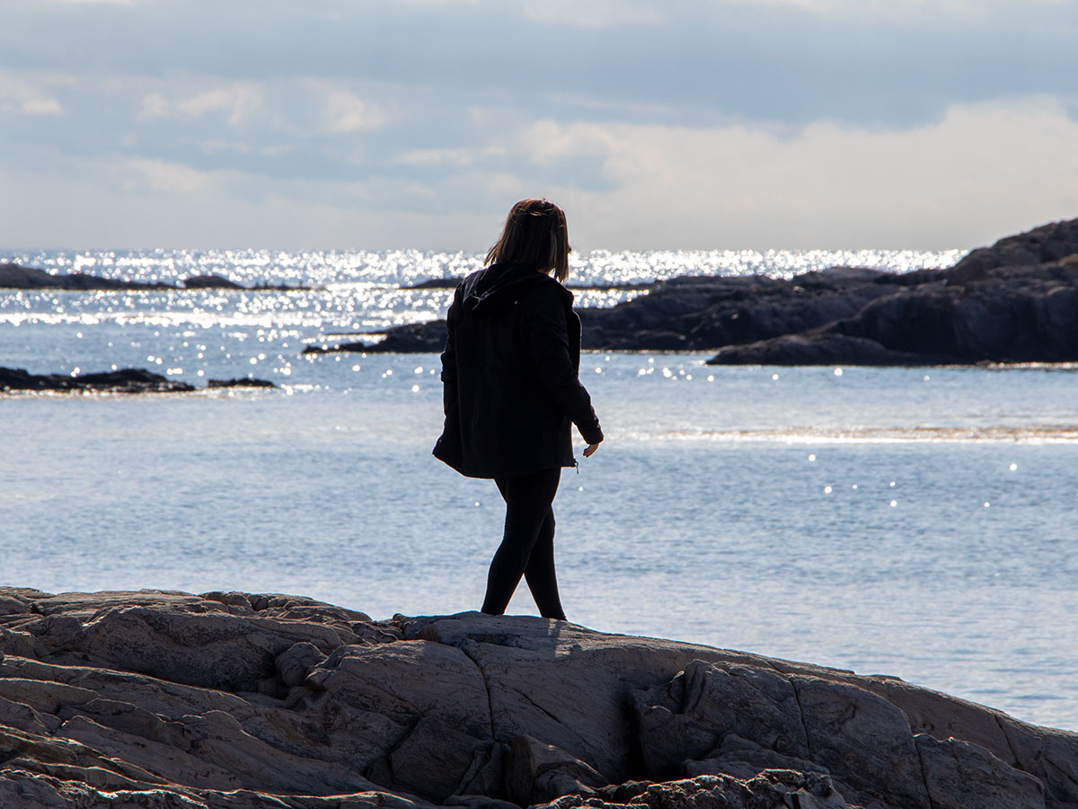 Girl Walking on Beach, Rocky Maine Coast