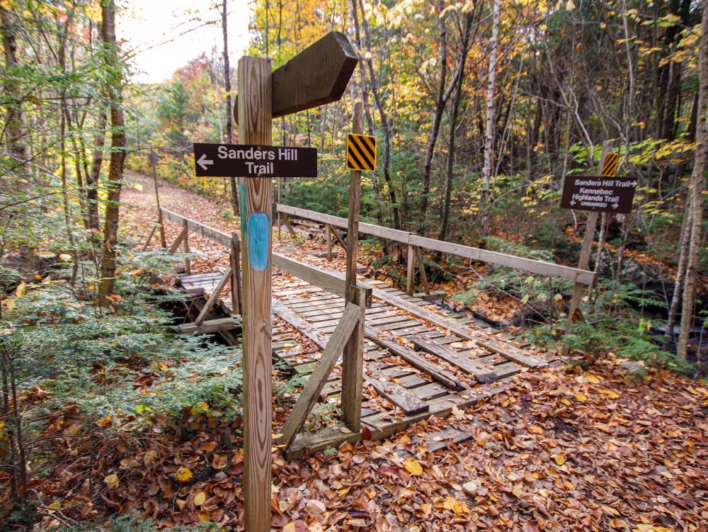 Sanders Hill Trail Sign & Wooden Bridge that Spans Beaver Brook