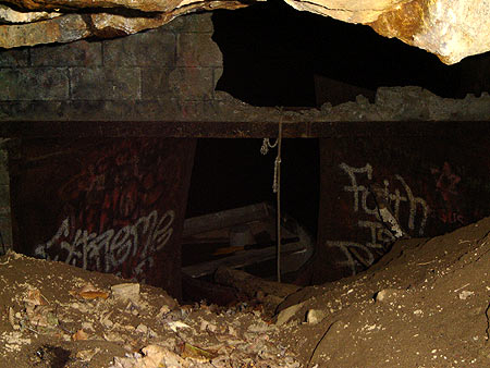Satan Caves Dirt Pile in Front of Doors