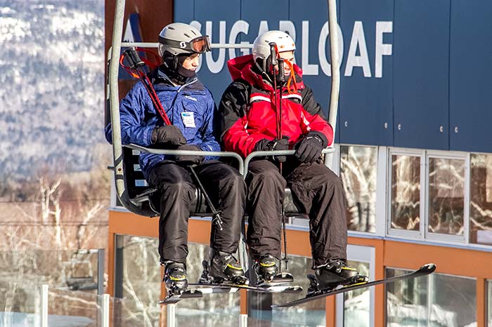 Two Skiers on Chair Lift