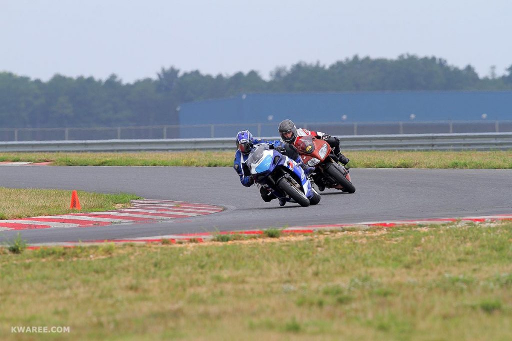 Sportbikes Leaning Around Bend in Track