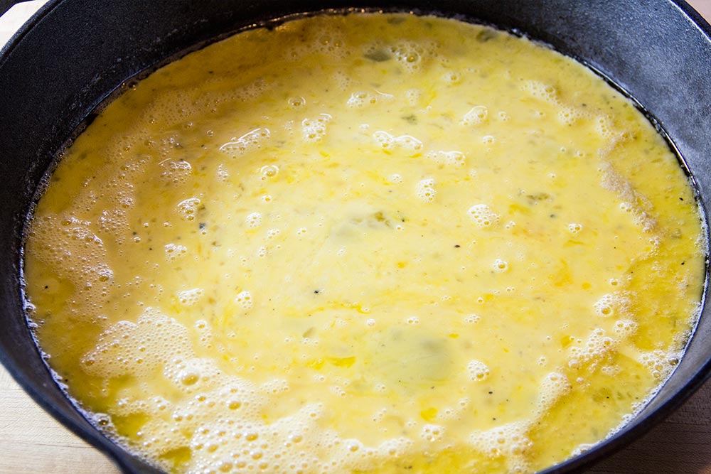 Adding Scrambled Eggs to Hot Skillet
