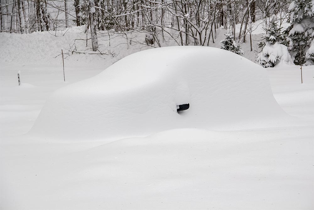 Car Completely Covered with Snow