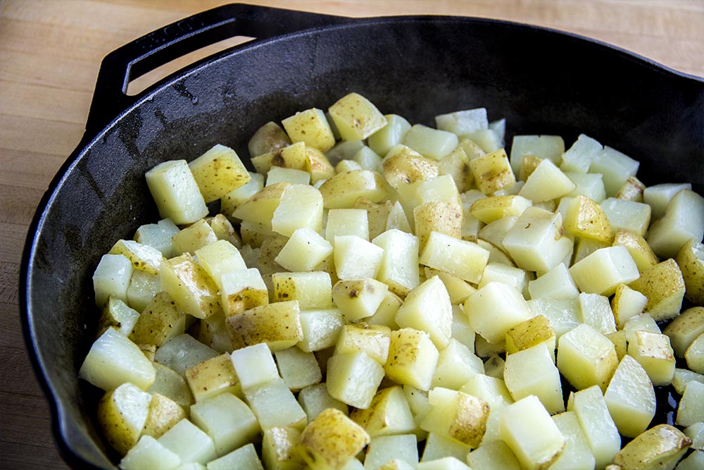 Cooking Diced Potatoes with Cast Iron Pan