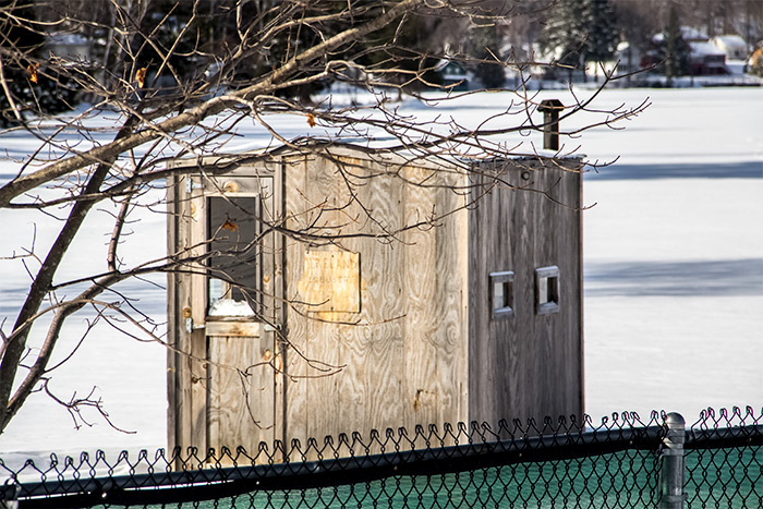 Ice Fishing House on Lake