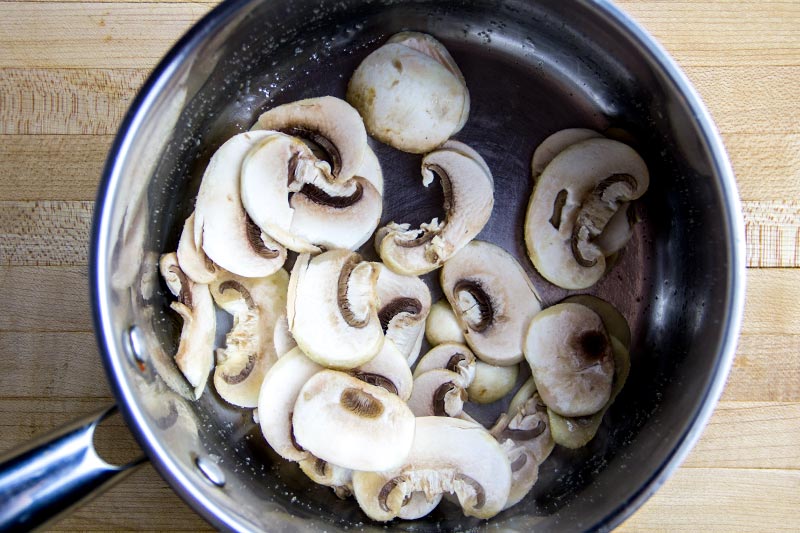 Sliced White Button Mushrooms in Saucepan