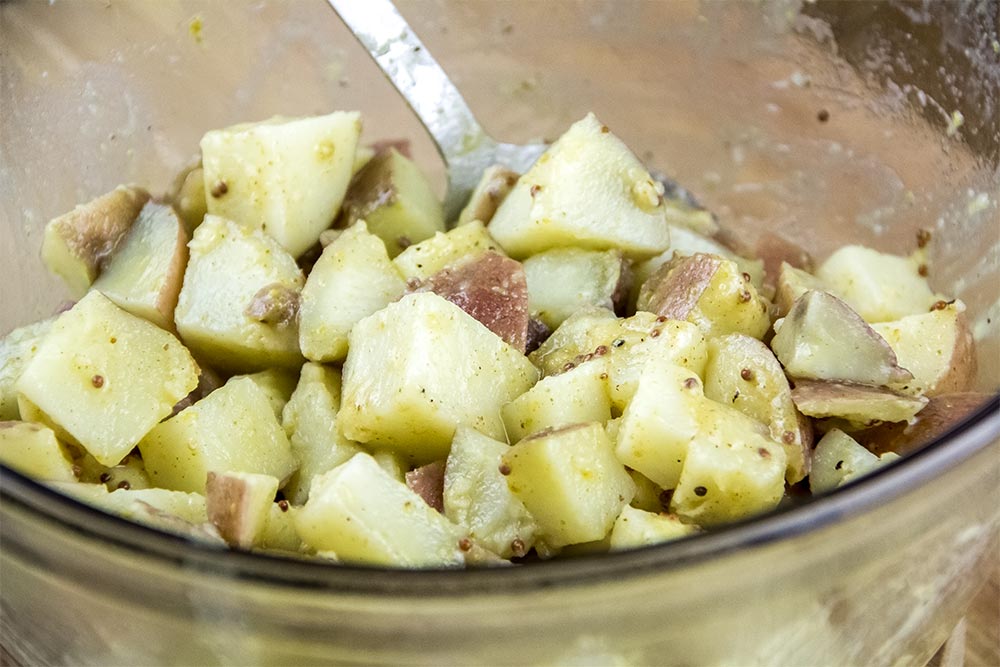 Cooked Red Potatoes Coated with Mustard Dressing