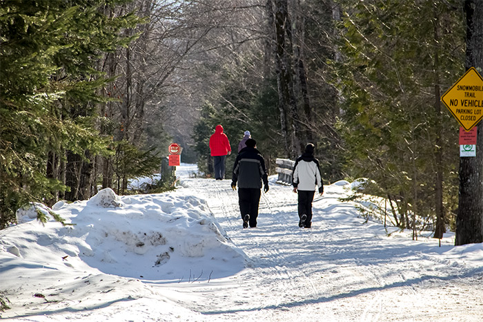 Walkers and Hikers on Snow Covered Narrow Gauge Trail