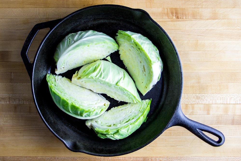 Slices of Cabbage Wedges in Cast Iron Skillet
