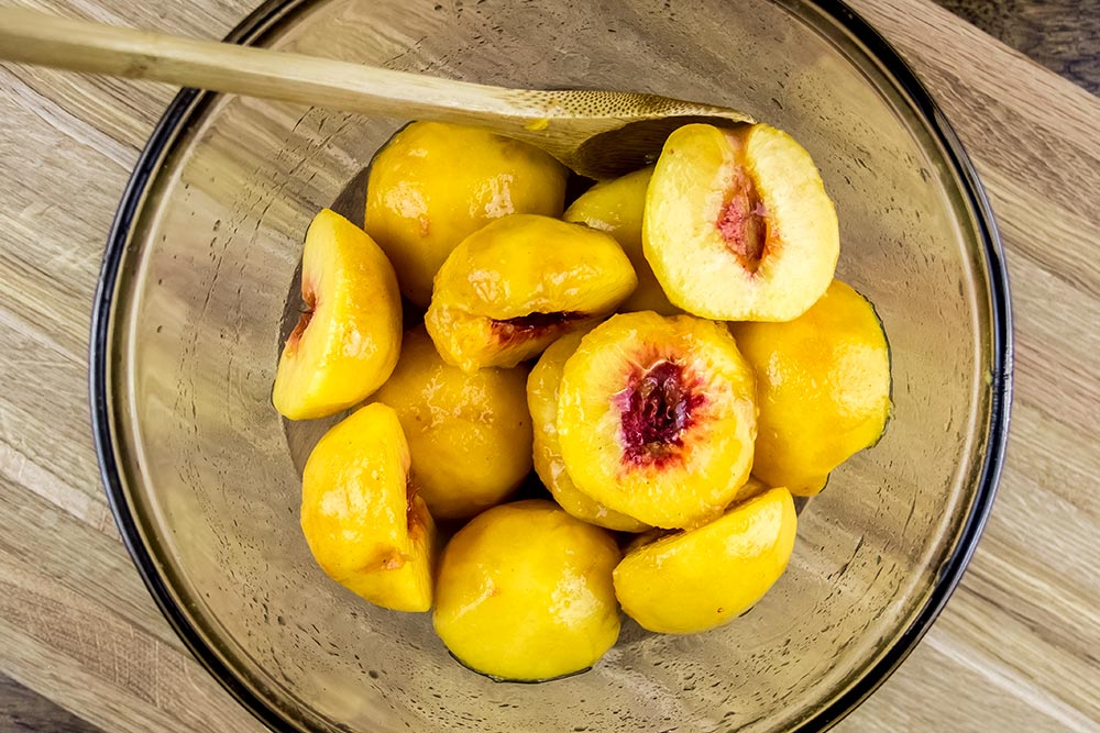 Coated Peach Halves with Lemon and Sugar Mixture
