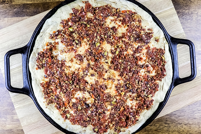 Olive Tapenade Spread Out on Pizza Dough