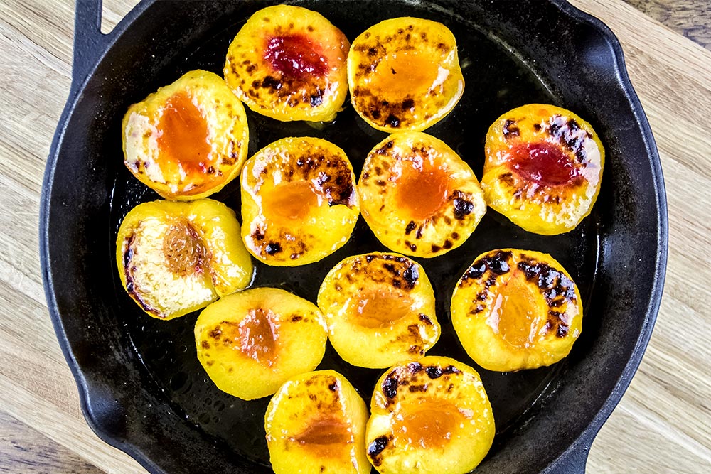 Brushed Honey and Olive Oil Mixture Over Charred Peaches