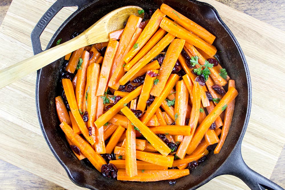 Carrots, Cranberries, and Parsley in Cast Iron Skillet