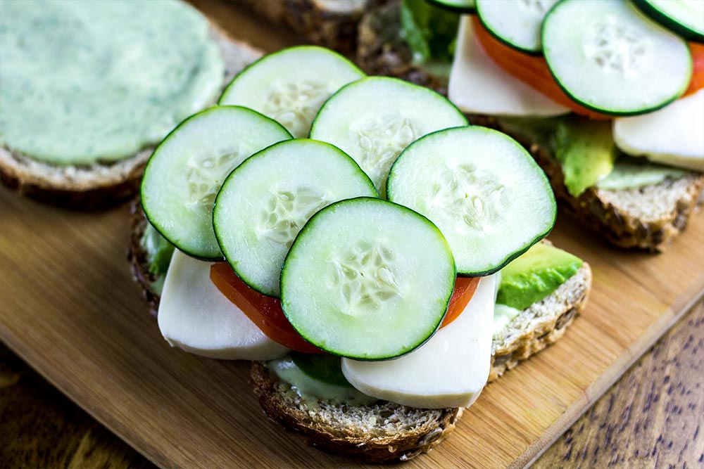 Adding Cucumber Slices to Sandwich